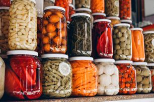 Preserve jars on a pantry shelf